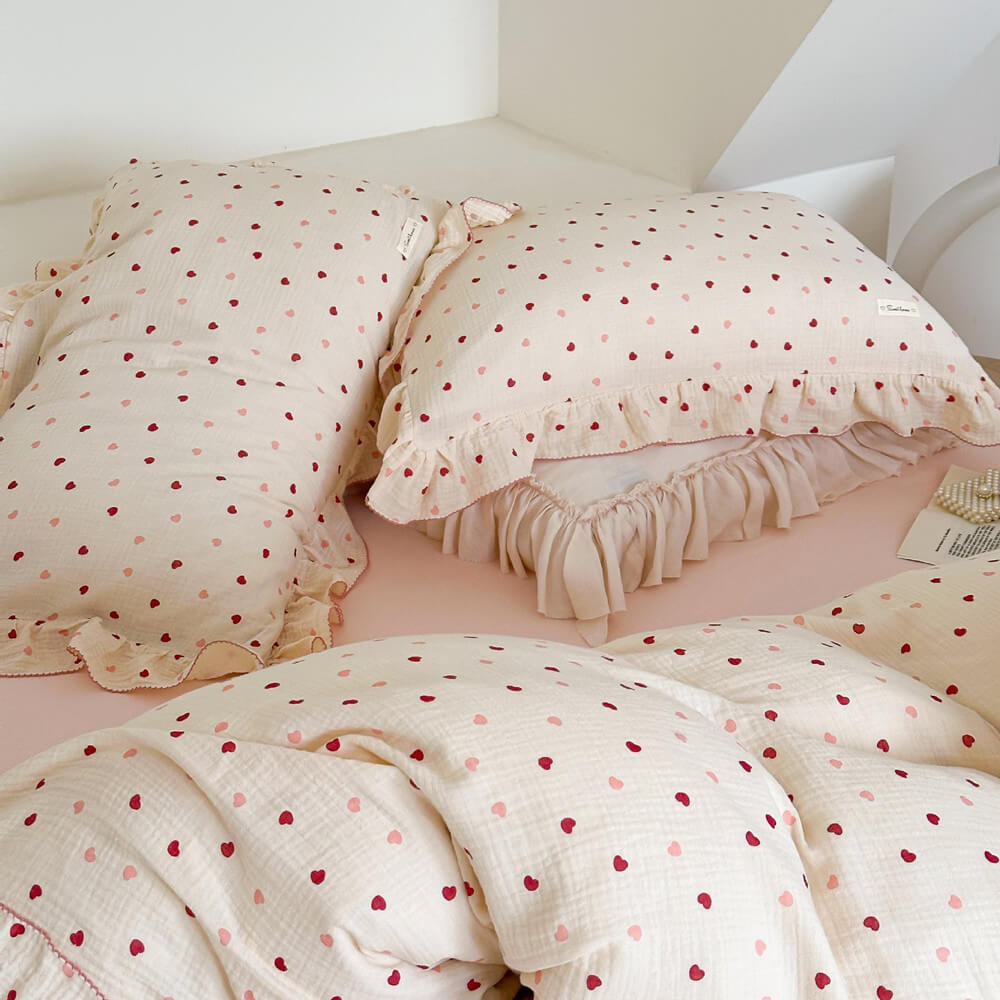 Close-up of the Girls Ruffle Duvet Cover Set in soft cotton, featuring a delightful heart print bedding design.