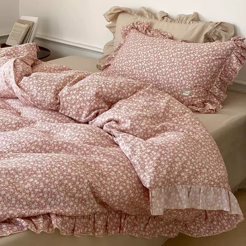 Angled close-up of the pink Ditsy Floral Bedding Set, highlighting the layered appearance and soft feel of the cotton muslin material.