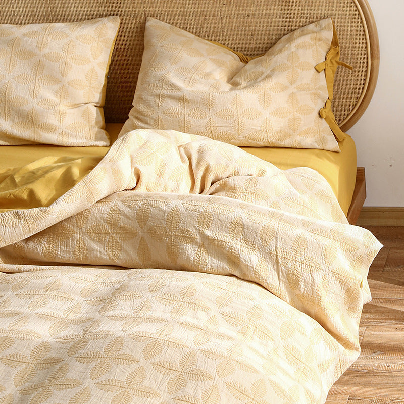 Elegant Queen Size Bedding Set in soft yellow jacquard, paired with a solid yellow sheet.