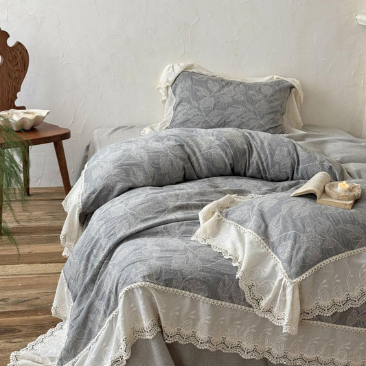 French vintage lace trim grey linen cotton bedding set with botanical pattern in cozy bedroom
