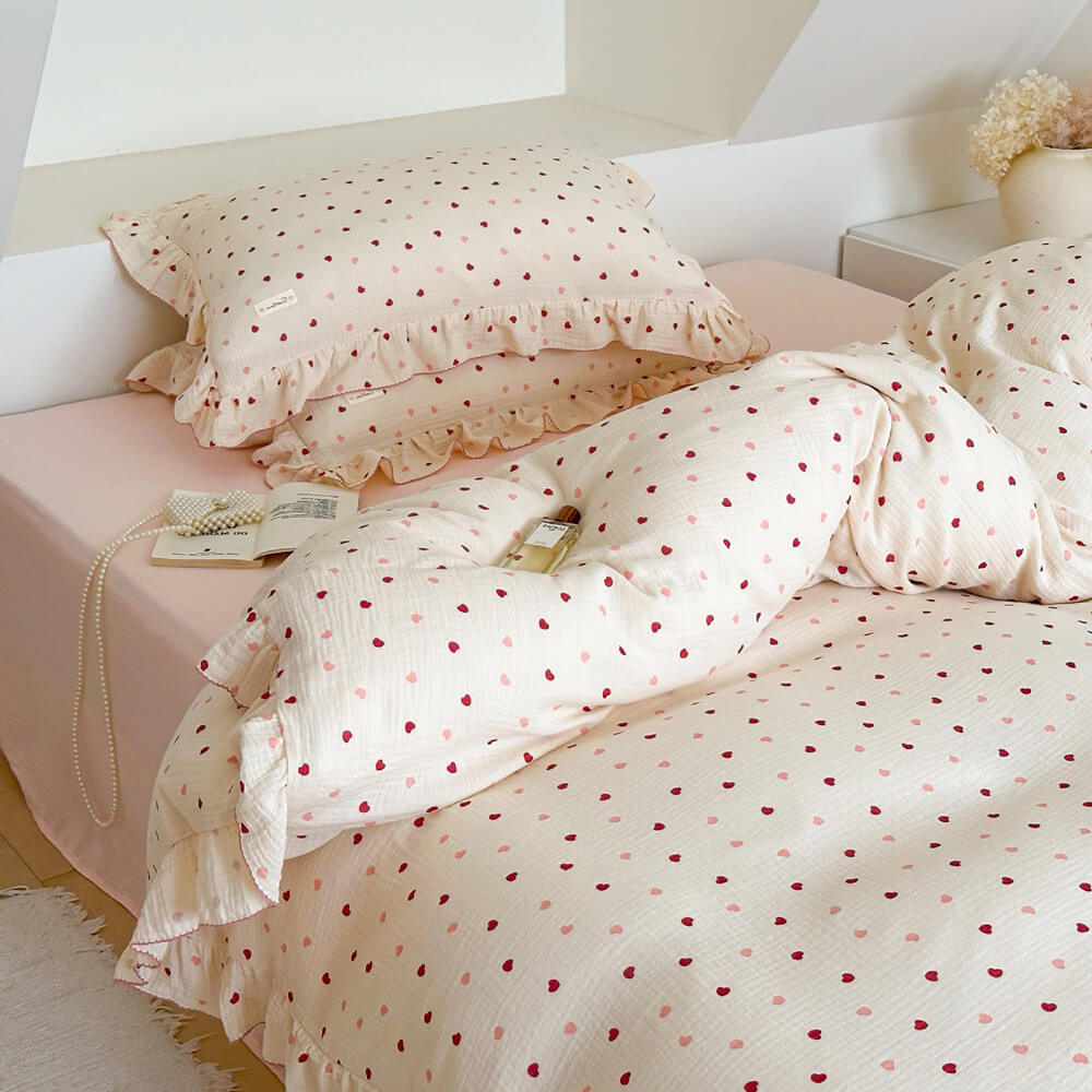 Full view of the Heart Print Bedding set with charming ruffle duvet cover and shams in a bright, cozy attic room.