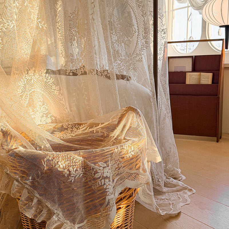 Romantic lace canopy curtains draped on a four-poster bed in a cozy sunlit bedroom
