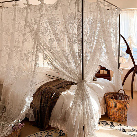 Romantic lace canopy bed with bow ties in a sunlit cozy bedroom, wicker basket nearby.