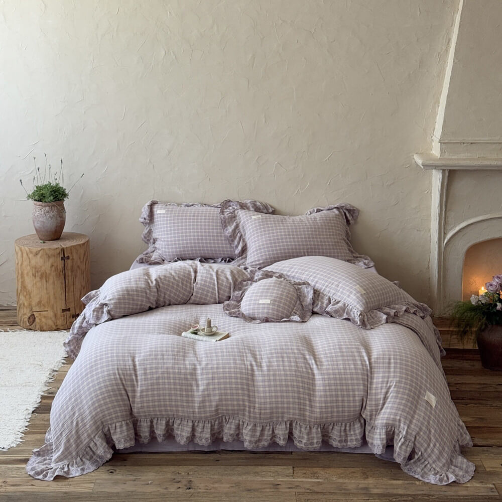 Lavender plaid ruffle bedding set styled on a bed with matching pillowcases, soft cotton muslin fabric