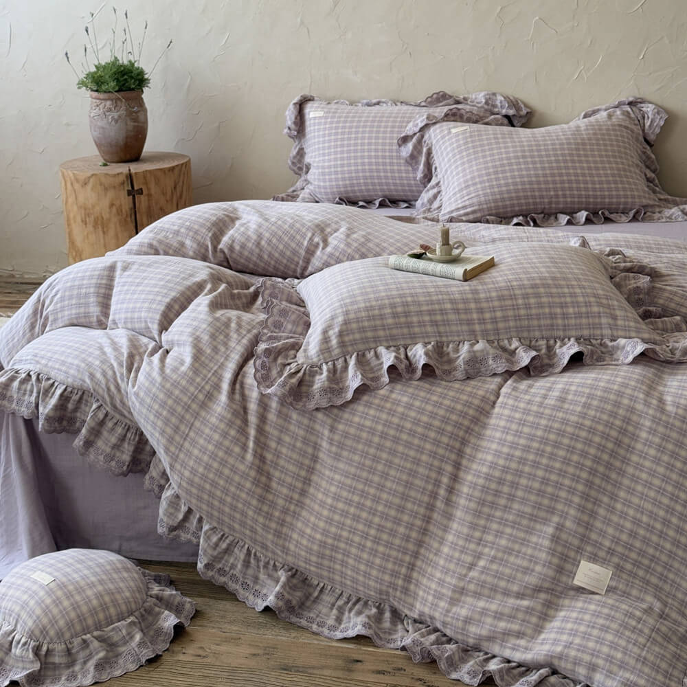 Front angle of lavender plaid ruffled duvet cover set with embroidered lace and ruffle detail