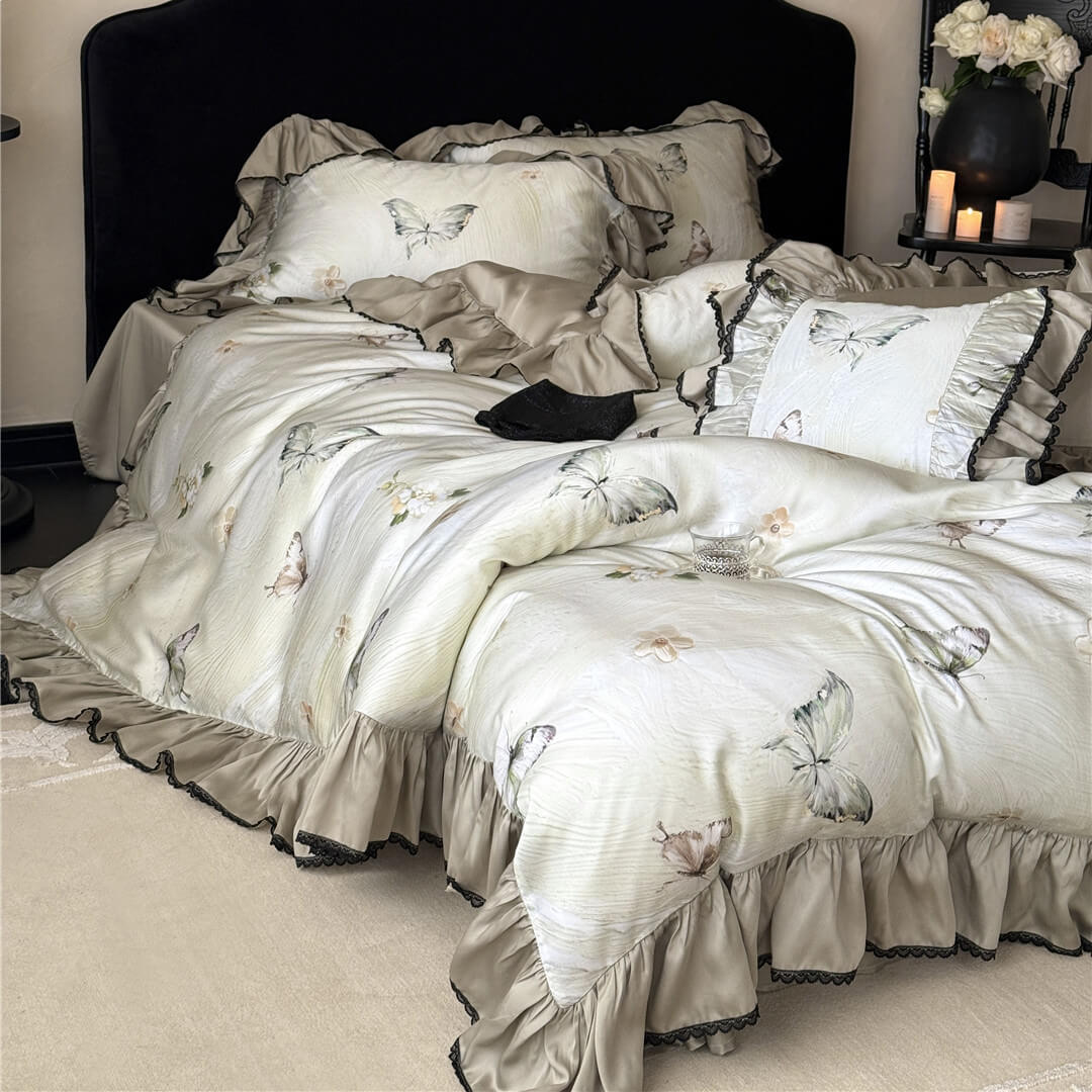 Wider angle view of the Soft TENCEL™ Butterfly Duvet Cover Set, illustrating the romantic drape and the overall plush appearance of the bedding.