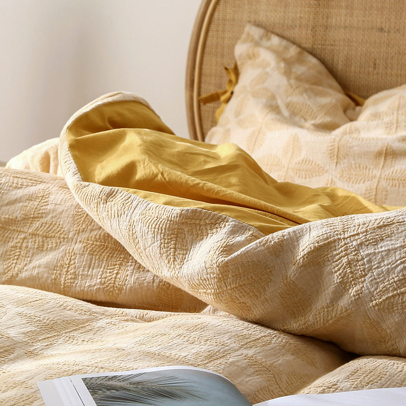 Elegant Queen Size Bedding Set in soft yellow jacquard, paired with a solid yellow sheet.