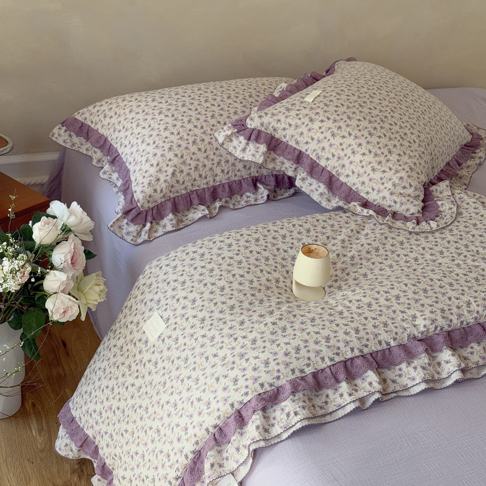 Comfortable bedding stack in botanical lilac floral pattern