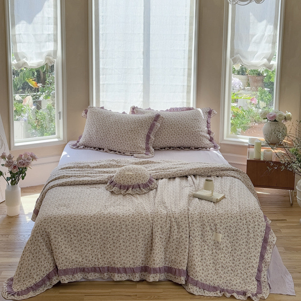 Bright and airy room styled with floral gauze comforter and ruffles