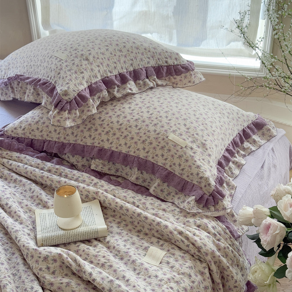 Comfortable bedding stack in botanical lilac floral pattern