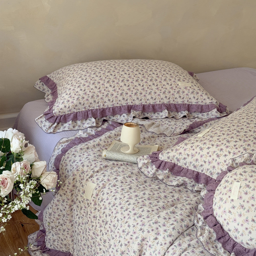 Natural light detail of floral comforter with romantic design