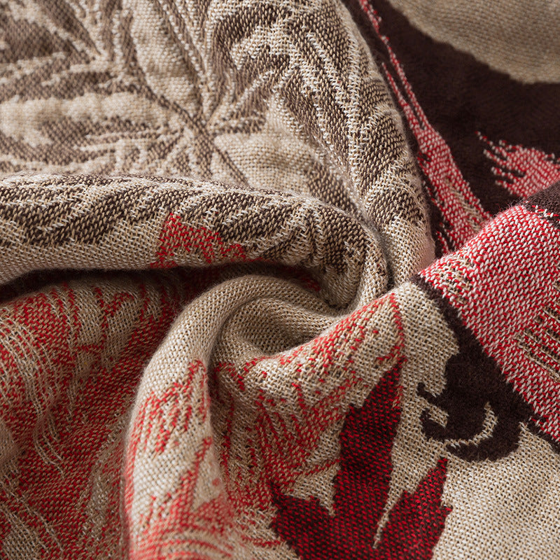 Close-up of jacquard-woven chickadee and leaf texture in cotton yarn