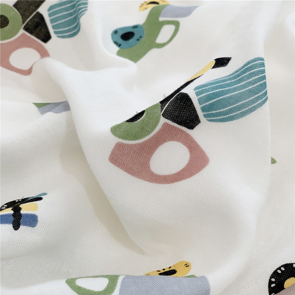 Detailed macro shot of the breathable bamboo fabric with a modern, colorful abstract vehicle pattern.