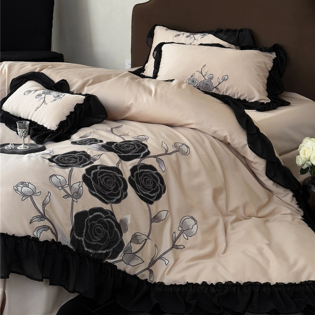 Warm taupe bedding with black floral embroidery and trim
