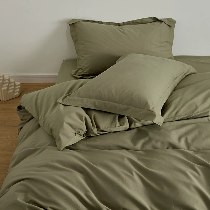 Olive Brushed Cotton Duvet Cover Set on a bed, displaying the Soft & Cozy Bedding with subtle depth.