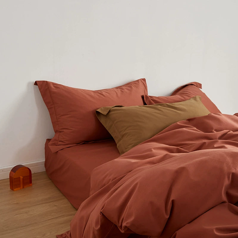 Close-up of a Rust Brushed Cotton Duvet Cover Set with pillow, emphasizing the Soft & Cozy Bedding.