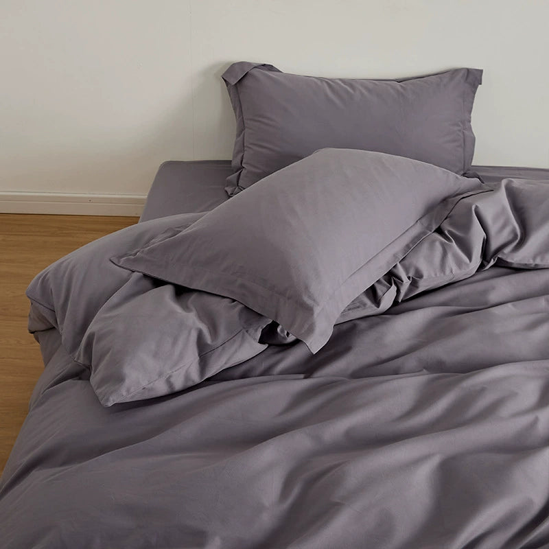 Violet Brushed Cotton Duvet Cover Set on a bed, featuring the Soft & Cozy Bedding in a muted purple shade.