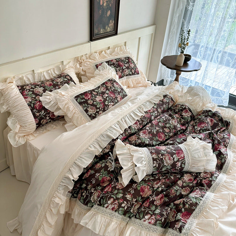 Side angle of vintage rose bedding in dark floral print