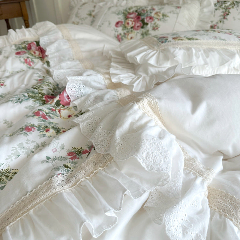 Floral fabric with delicate lace and ruffles on cotton bedding