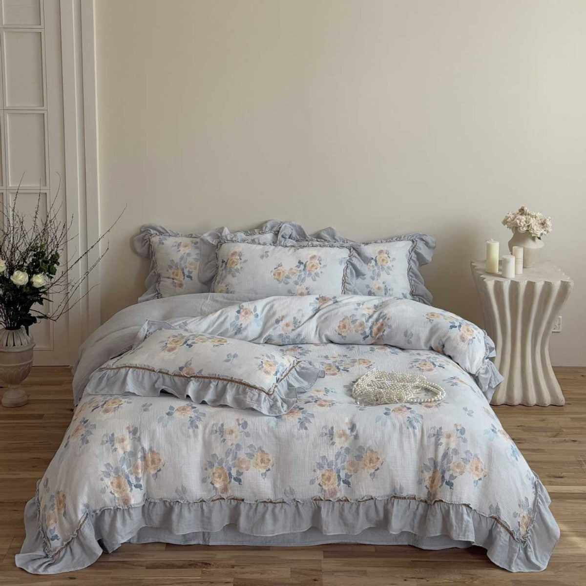 Full view of vintage floral gauze bedding on bed