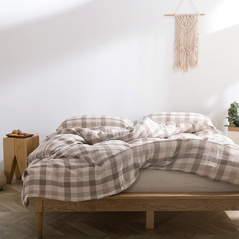 Soft gauze bedding in beige plaid with natural light