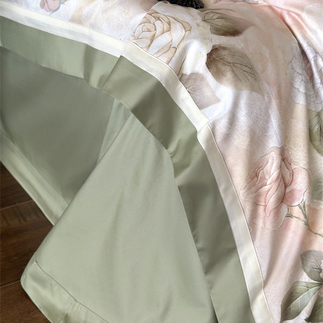 Close-up of green flat sheet and hem detail on rose bedding set