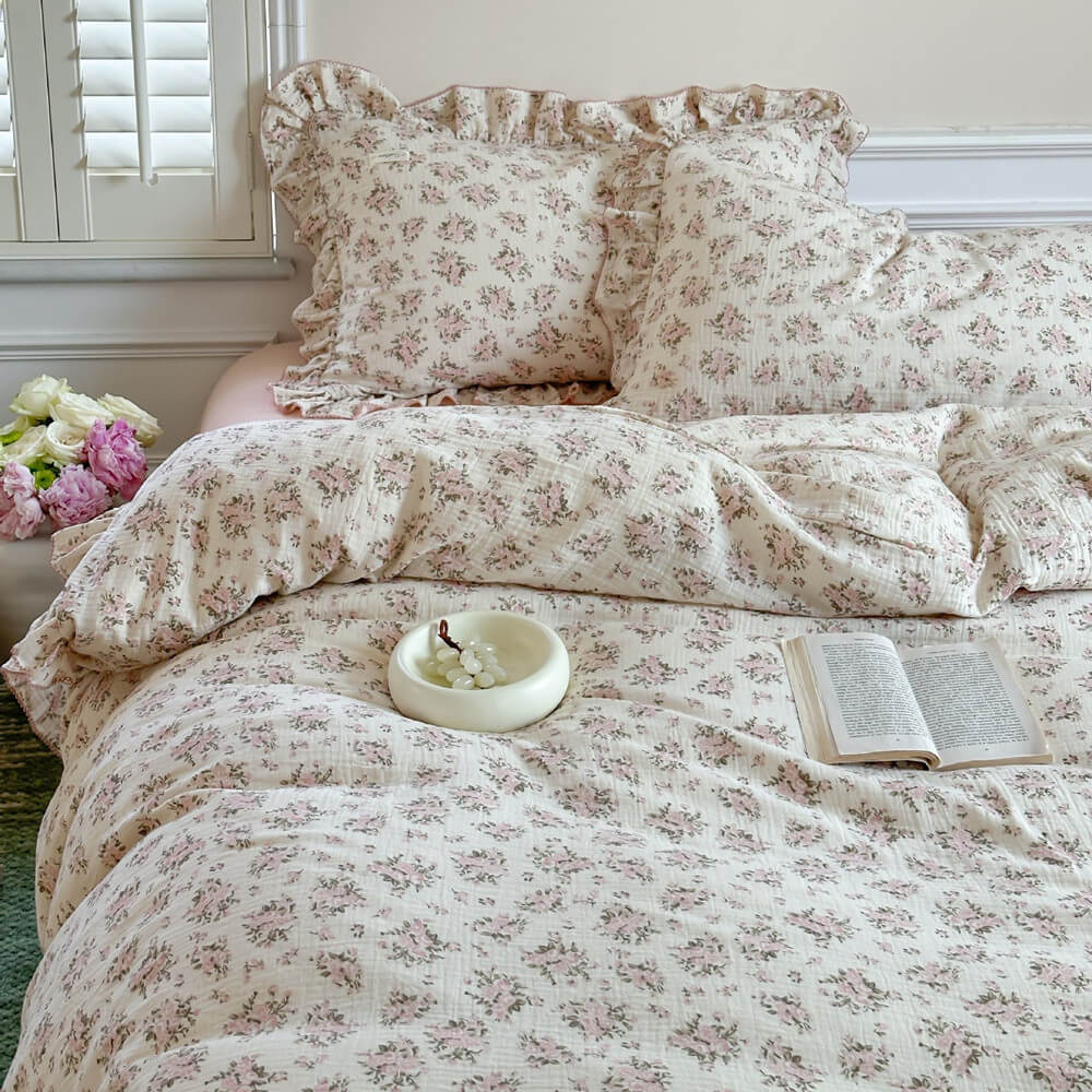 Twin Size Pink Floral Ruffled Cotton Gauze Duvet Cover Set on a bed with two matching ruffled pillow shams, evoking a cottagecore and shabby chic aesthetic.