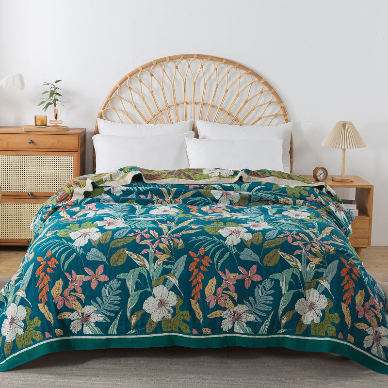 Double-sided cotton throw blanket with colorful botanical motifs