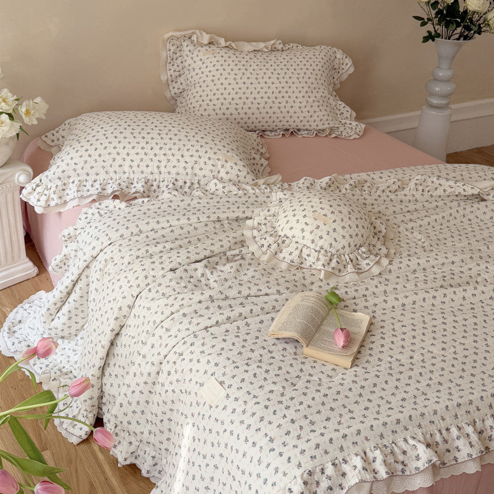 Romantic pink rose floral comforter styled with matching pillows