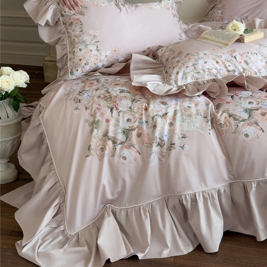 Close-up of floral print on blush ruffled bedding
