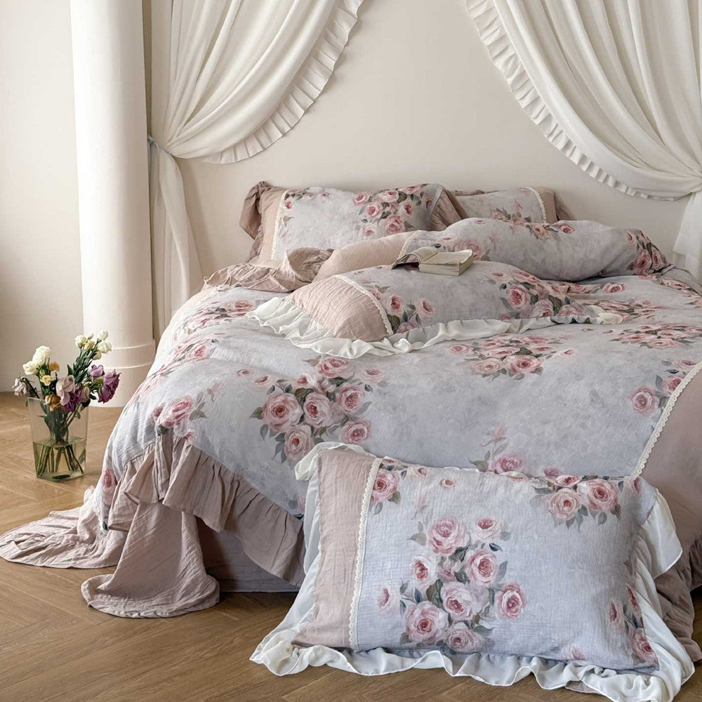 Blush pink and gray floral bedding with ruffle details and soft cotton gauze texture