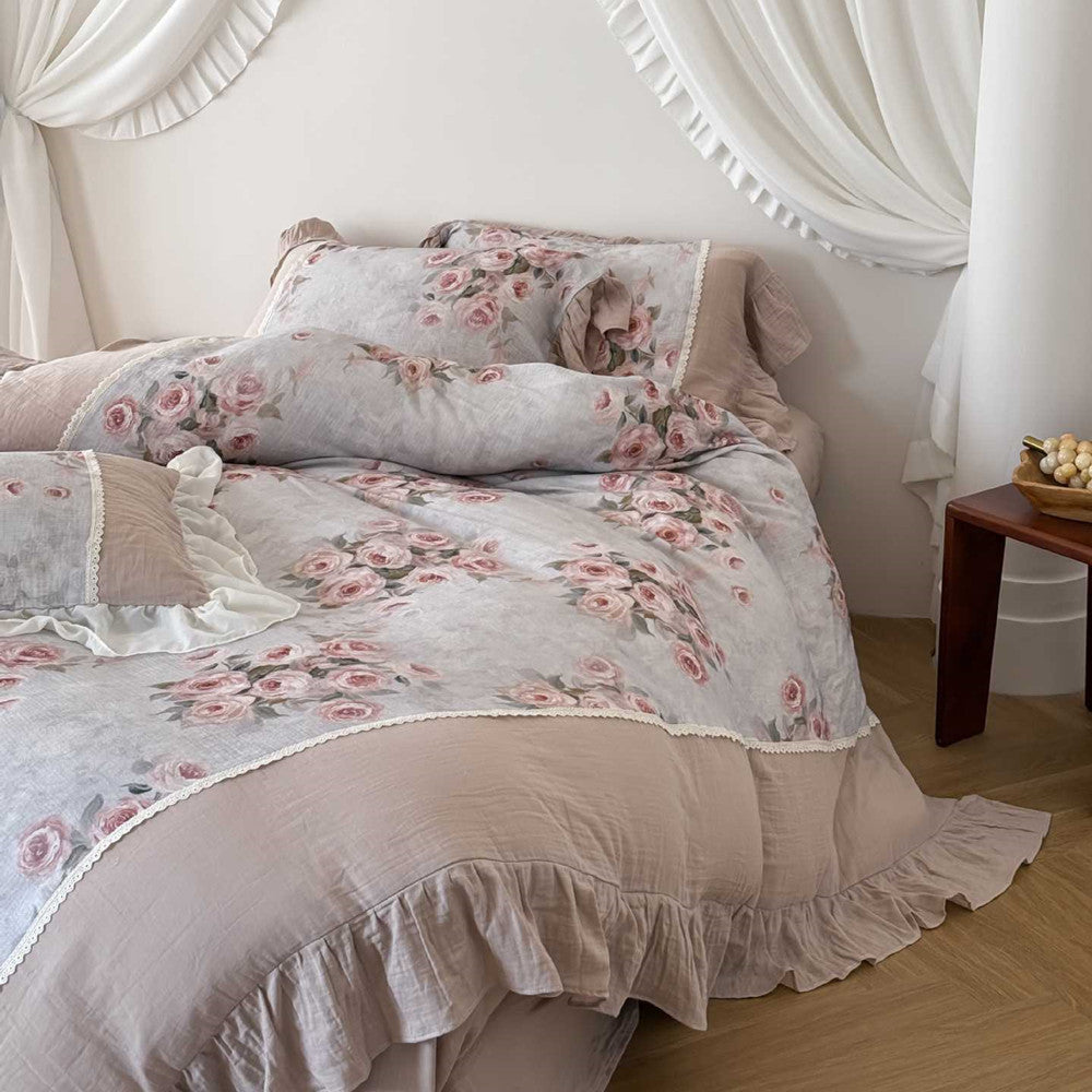 Cozy cotton gauze duvet cover with pink roses and ruffle trim on neutral background