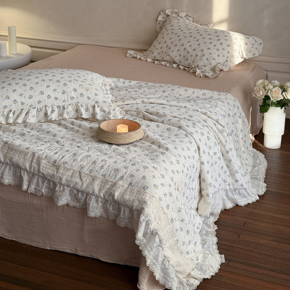 Full bed view with ruffled cotton gauze comforter in rose print