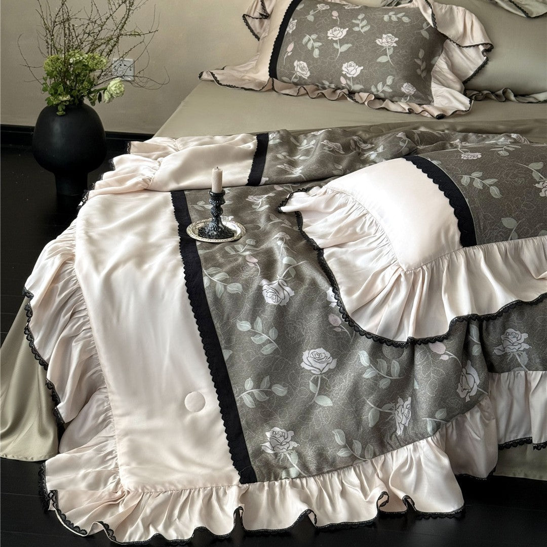 Close-up of olive gray TENCEL comforter fabric and rose pattern