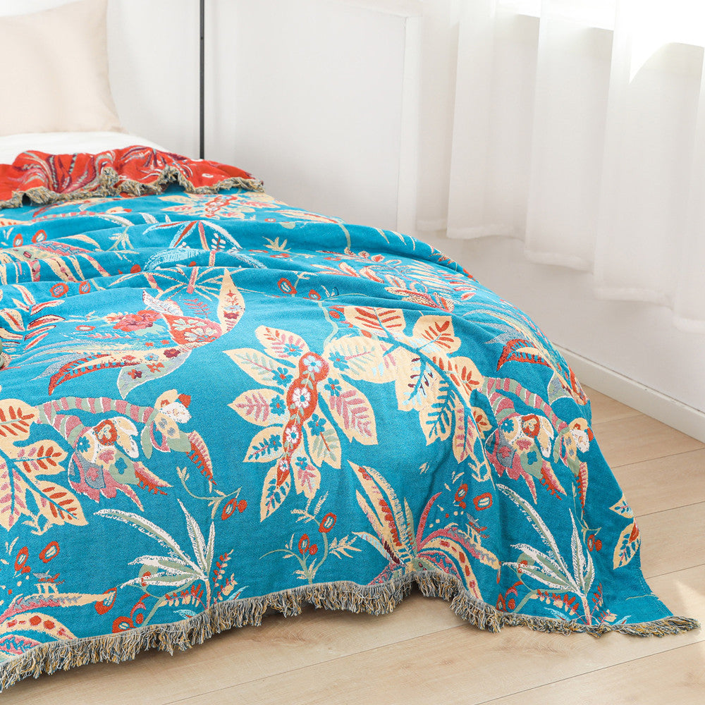 Bright floral jacquard throw blanket styled on full-size bed