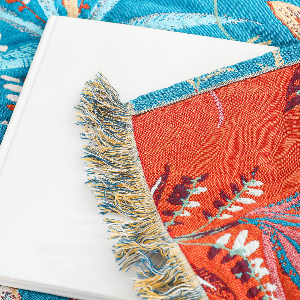 Close-up of cotton jacquard fabric with colorful tropical leaves