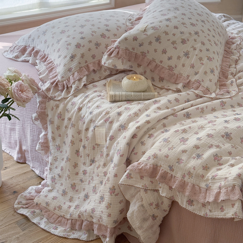 sideview of vintage rose floral comforter with ruffles