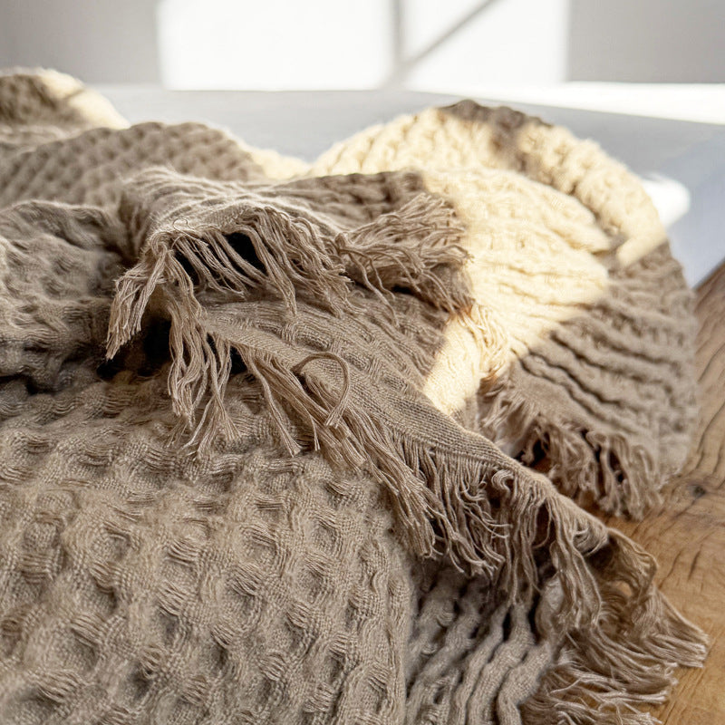 Soft brown waffle throw blanket with fringe detail