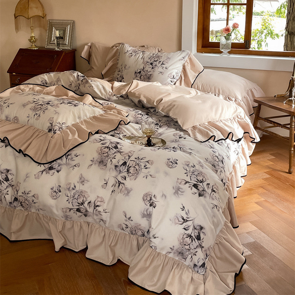 Side view of ruffled floral bedding set with neutral color palette