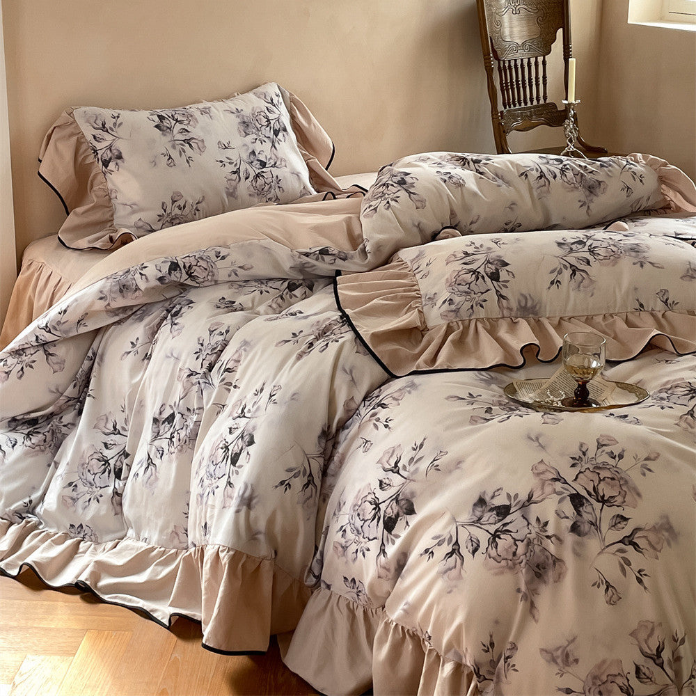 Full view of romantic floral cotton bedding with layered design