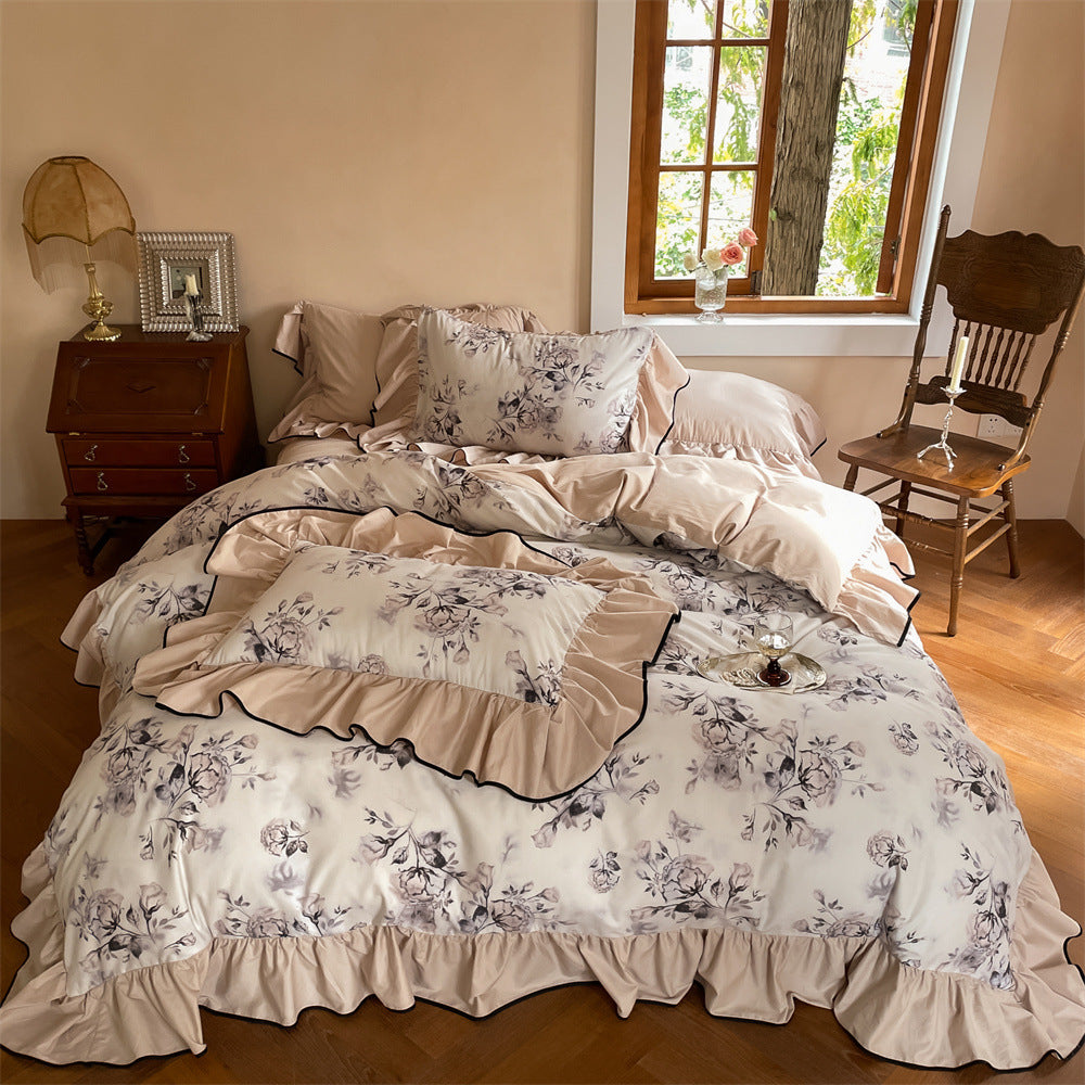 Watercolor floral cotton bedding set with ruffled trim in soft nude tones