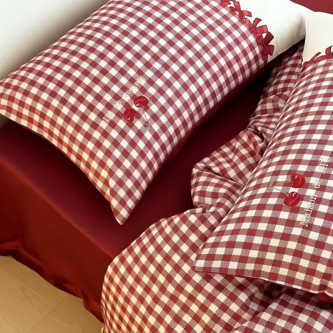 Red and white gingham cotton bedding set with embroidered cherries on soft sheets from StuffedHome