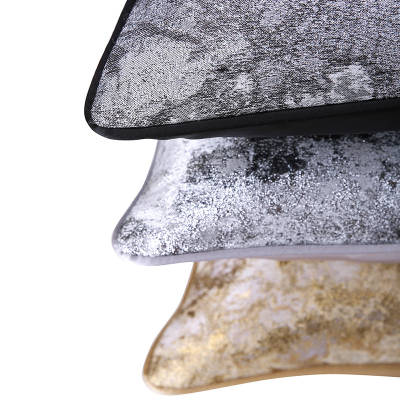 Stack of abstract textured decorative pillow covers in silver and gold from StuffedHome