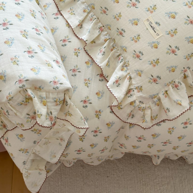 Floral patterned fabric with ruffled edges on a plain background