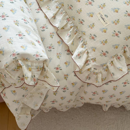 Floral patterned fabric with ruffled edges on a plain background