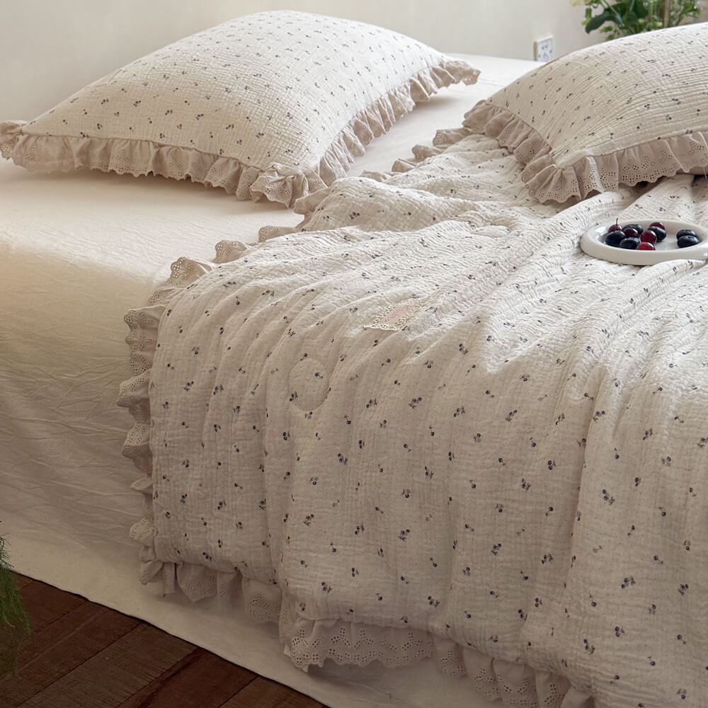 Pastoral design blueberry printed cotton gauze pillows with matching ruffled lace trim comforter, featuring a decorative white plate of fresh berries in a minimalist sunlit bedroom.