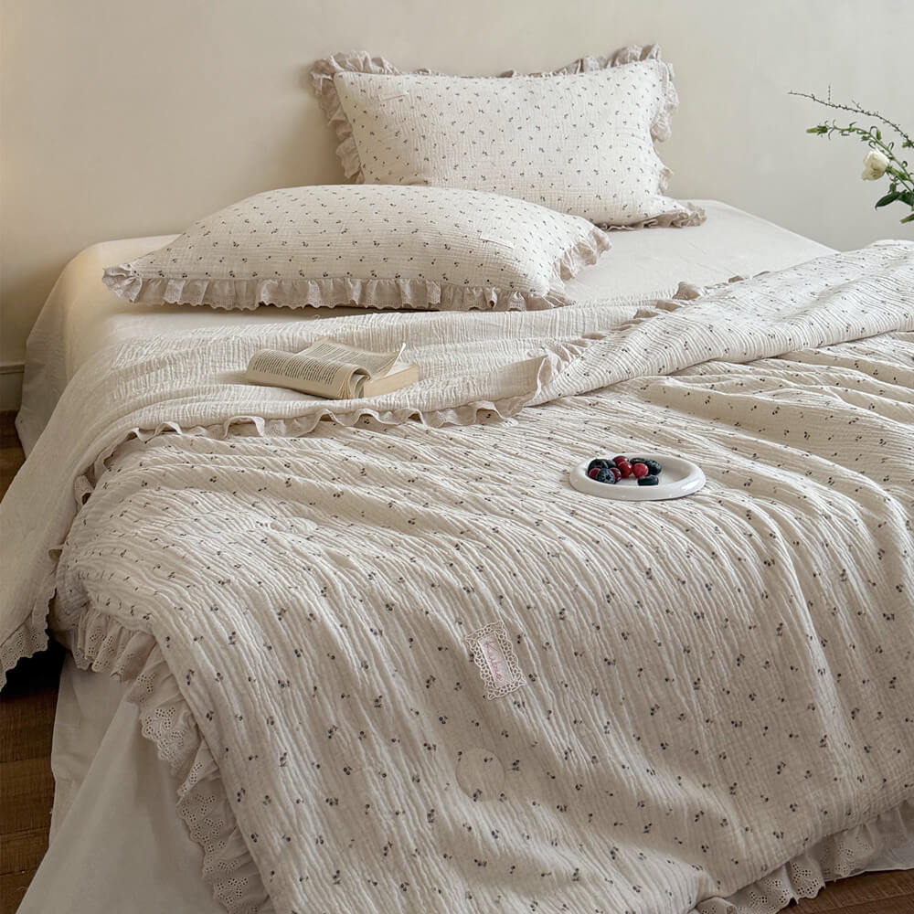 Cozy French country style bedroom decor featuring a full set of cream blueberry botanical print bedding with beautiful scalloped eyelet ruffle lace accents.