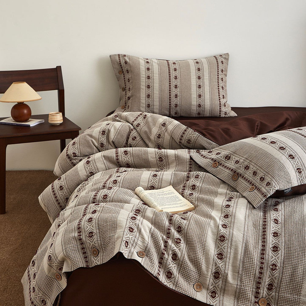 Boho cotton jacquard bedding set with geometric patterns on a cozy bed, wooden nightstand nearby