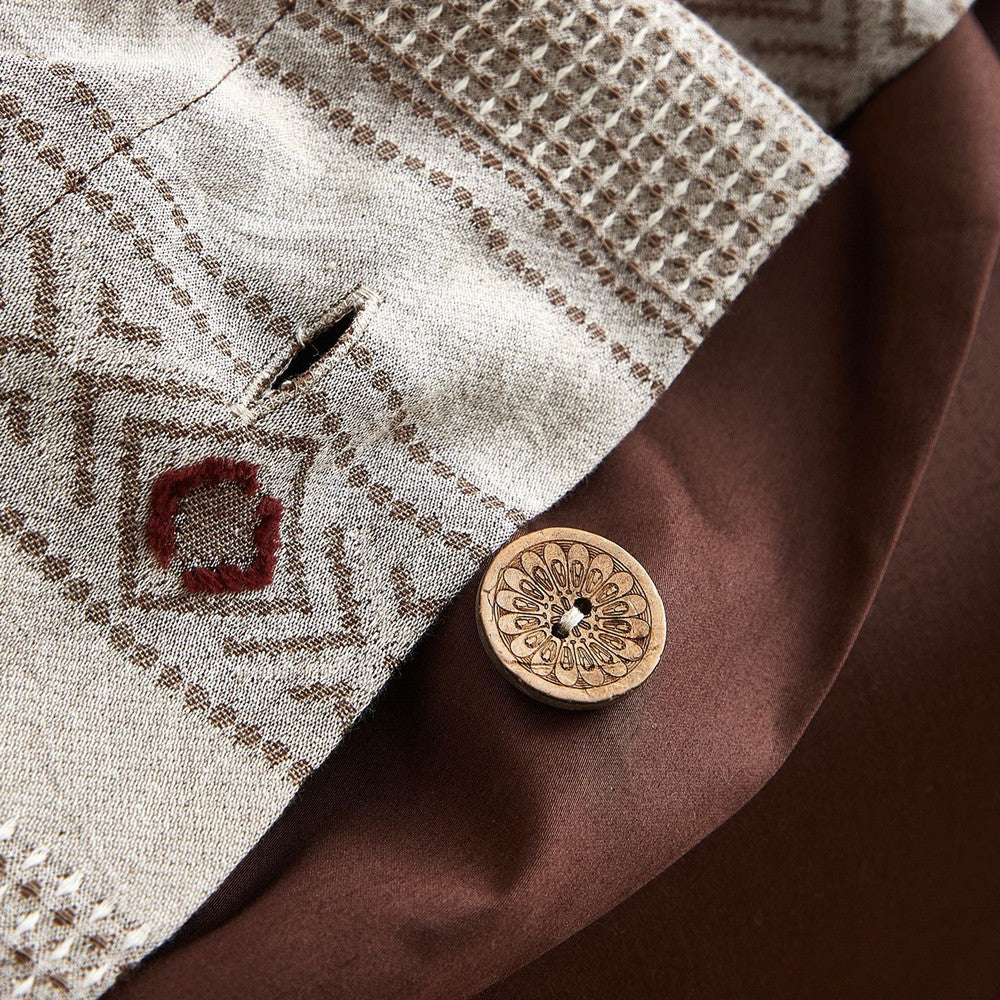 Boho cotton jacquard bedding with geometric embroidery and a decorative wooden button