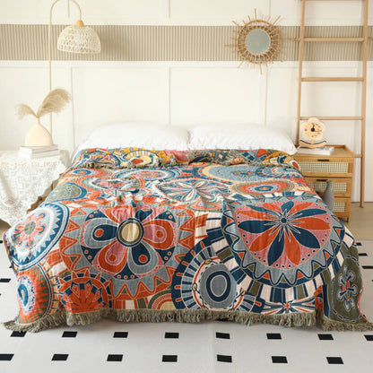 Boho geometric cotton throw blanket with retro circle pattern styled on a bed